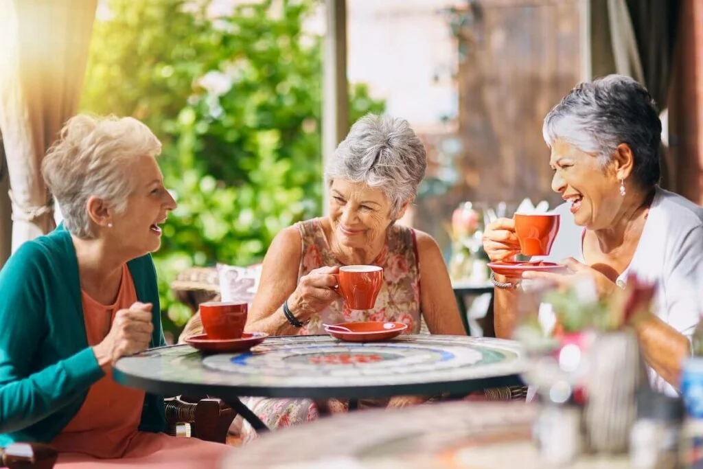 Seniors sitting in group SaraBella Senior Living