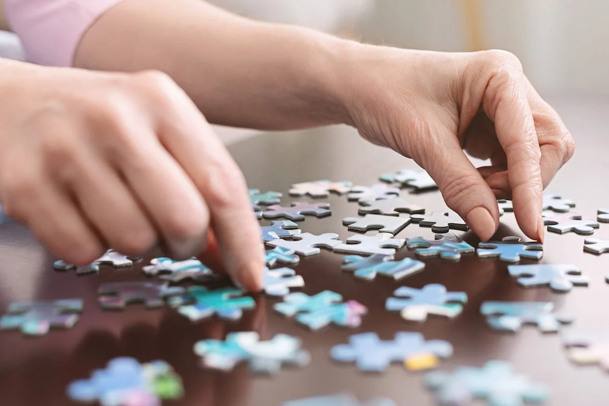 Senior Woman Completing Puzzle_SaraBella Senior Living