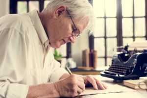 Senior Man Writing Letter_Memory Care in Sarasota