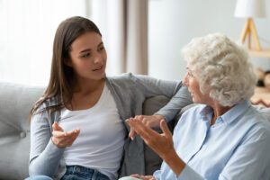 Senior Woman and Daughter Talk on Couch_Assisted Living in Sarasota