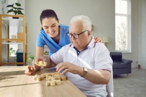 Caregiver taking care of older man with dementia