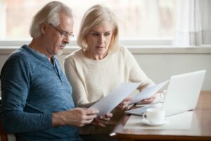 Couple of older adults going through their finances