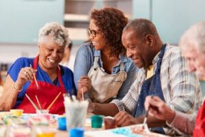 Group of older adults at an arts and crafts class.