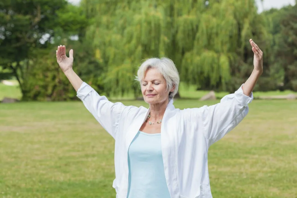 Independent woman doing yoga outdoors.