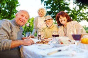 Older adults having a meal together