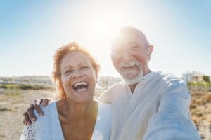 A couple of happy seniors on the beach