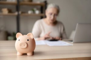 Older woman with a piggy bank