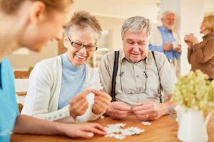 Memory care in Sarasota. Caregiver with residents