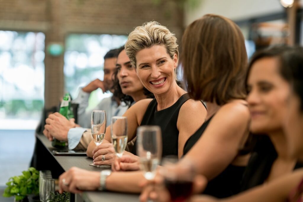 Professionals socialize with networking and drinks