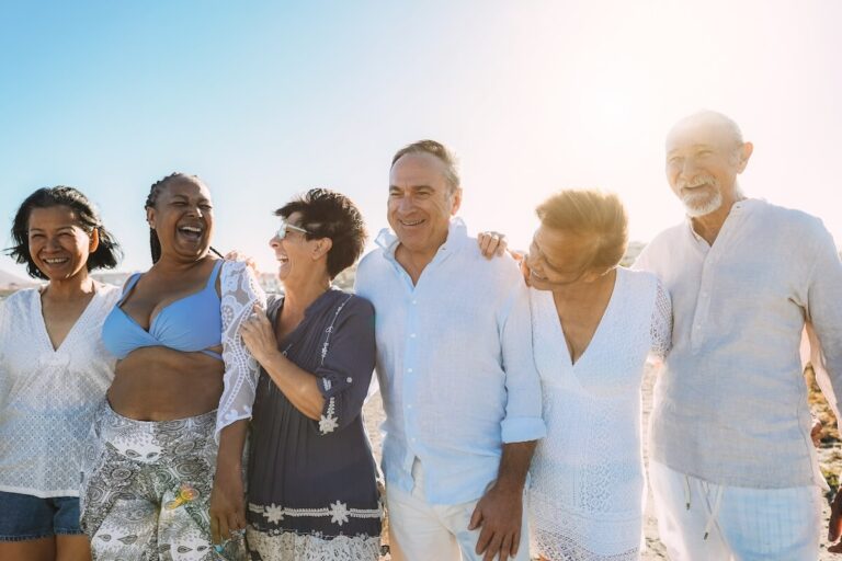 Group of joyful seniors by the beach