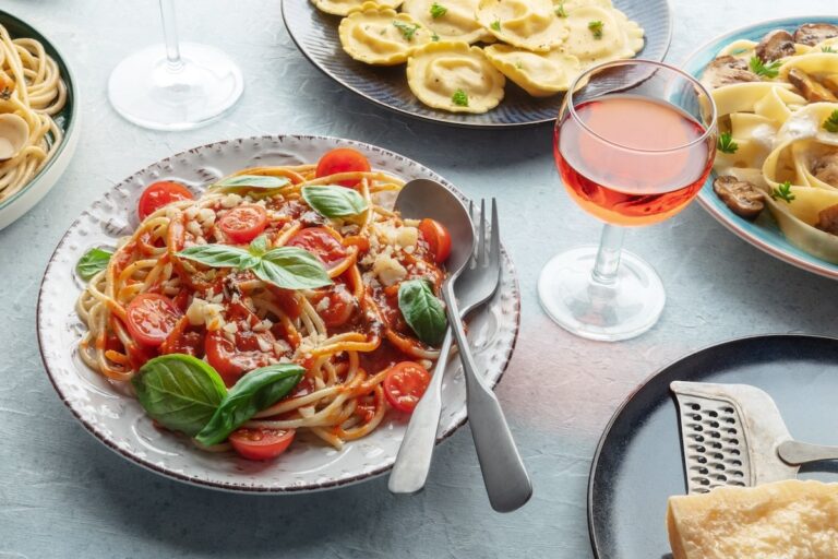 a beautiful dish of pasta with tomatoes and herbs