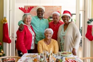 Seniors happily celebrating the holidays - SaraBella Senior Living Seniors happily celebrating the holidays